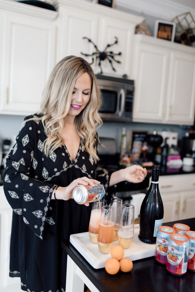A FRESH TWIST ON FALL MIMOSAS || SANPELLIGRINO RECIPES featured by top Nashville lifestyle blog Nashville Wifestyles. A FRESH TWIST ON FALL MIMOSAS || SANPELLIGRINO RECIPES - Nashville Wifestyles; It’s FOOTBALL time in TENNESSEE! Have your husbands also disappeared this football season? Mine only gets up to make another drink or to jump off the recliner to yell at the call a ref made and if his teams scores. While he and his buddies drink a few beers, I decided why not make a crafty cocktail for the ladies in the house? I love mimosas and champagne or prosecco drinks. I came up with a mimosa drink I love. Click here for my mimosa recipe for cocktails with friends.