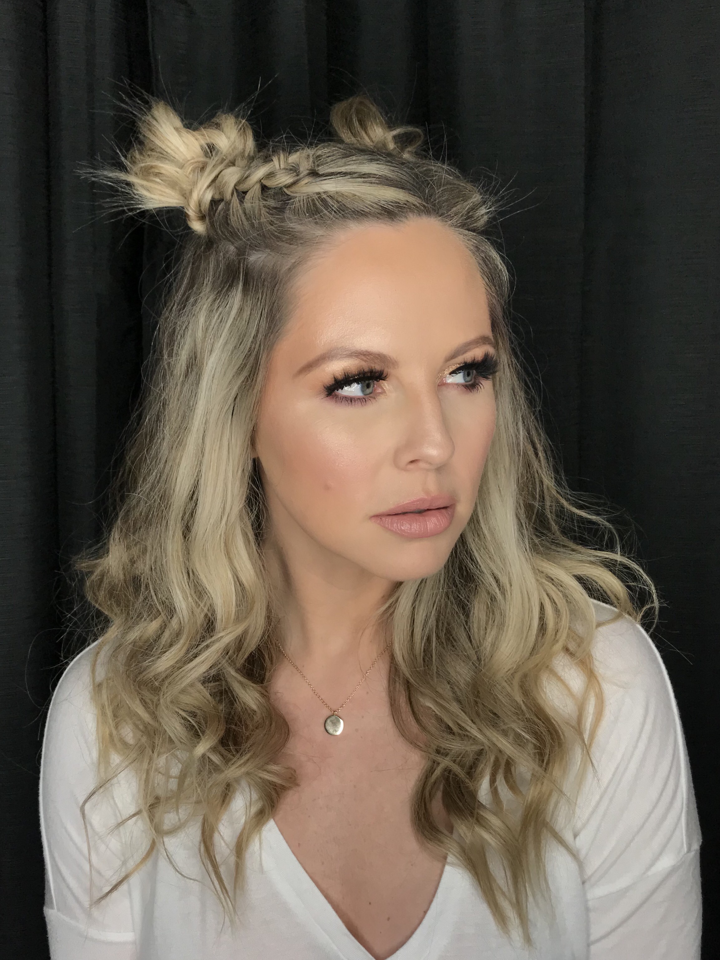 New Years Eve Style Guide featured by top Nashville life and style blog, Nashville Wifestyles. Your Complete New Years Eve Style Guide: Hair, Makeup, Outfits & Party Ideas - Nashville Wifestyles; I’m loving these double dutch pigtail braids buns by my friend Courtney. It’s so fun and versatile that you can rock it during the holidays or two days long like I did even to run errands ha. She’s giving a step by step on my YouTube channel for you. with New Years comes more makeup looks, parties and recipes. NYE is the ideal time to be as EXTRA as you wanna be. Amp up your New Years Eve style and wear the sparkles, wear the red lip and the smoky eye, rock the glitter and big hair.