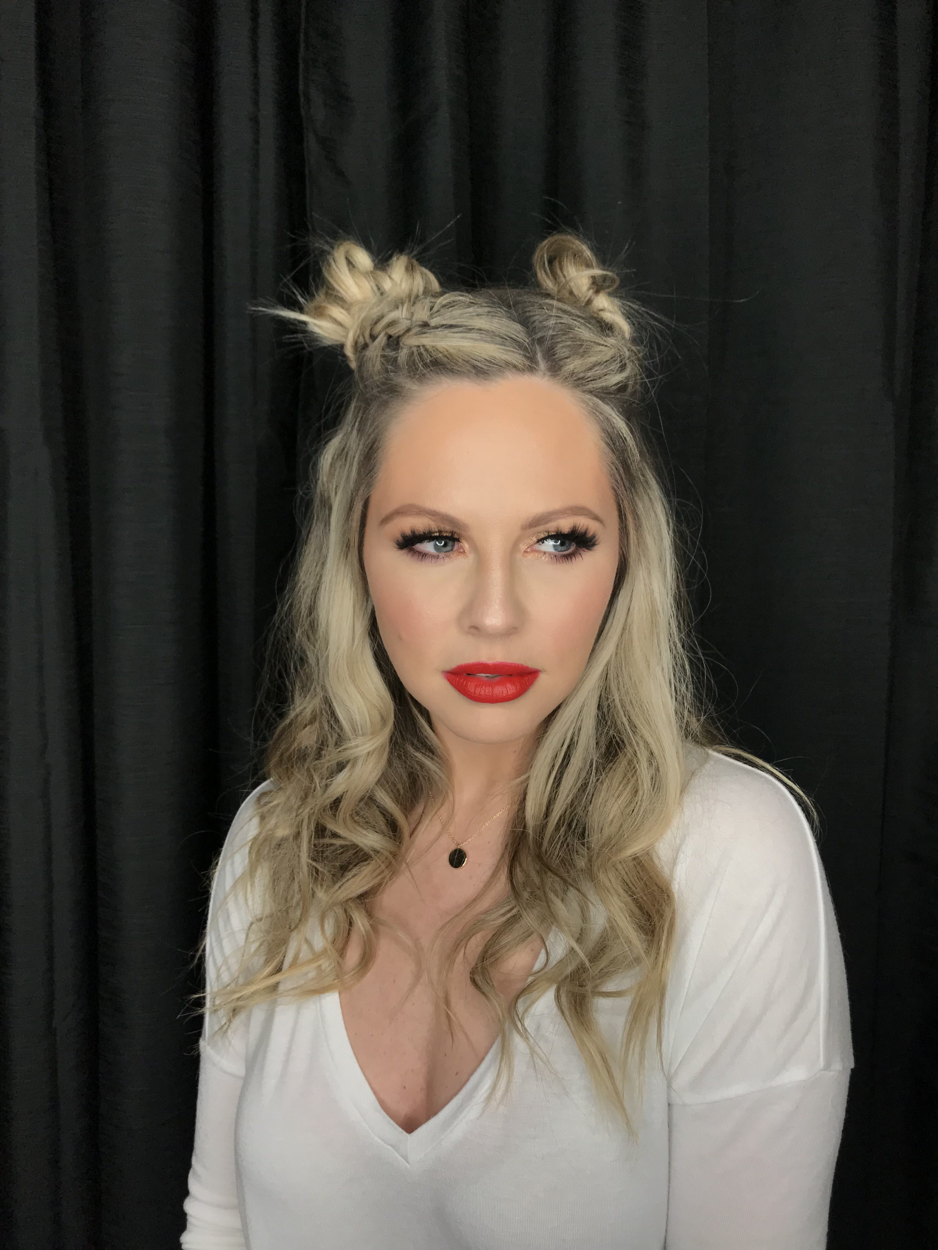 New Years Eve Style Guide featured by top Nashville life and style blog, Nashville Wifestyles. Your Complete New Years Eve Style Guide: Hair, Makeup, Outfits & Party Ideas - Nashville Wifestyles; I’m loving these double dutch pigtail braids buns by my friend Courtney. It’s so fun and versatile that you can rock it during the holidays or two days long like I did even to run errands ha. She’s giving a step by step on my YouTube channel for you. with New Years comes more makeup looks, parties and recipes. NYE is the ideal time to be as EXTRA as you wanna be. Amp up your New Years Eve style and wear the sparkles, wear the red lip and the smoky eye, rock the glitter and big hair.