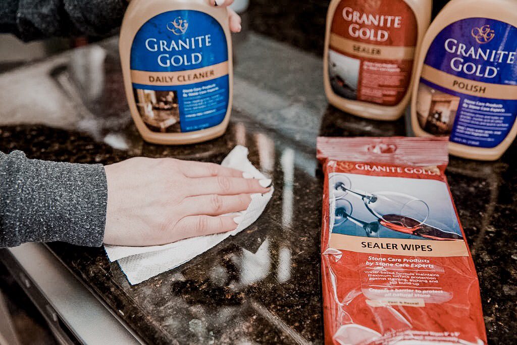 Best Way To Clean Granite || Nashville Wifestyles Cleaning Series - Nashville Wifestyles; The hardest part about cleaning is finding the right products for your home. Where to buy them? Where to find healthy products for your family? As a busy working mom, it's overwhelming to shop. I’ve been a customer of Grove Collaborative products for a year and I trust they vet the brands to make sure they're good for my home. It makes living a healthy lifestyle easier. No more going through the grocery aisles, now I can let it arrive at my door. Click to learn more! Best Way To Clean Granite featured by top US lifestyle blog Nashville Wifestyles; Image of a woman cleaning her kitchen.