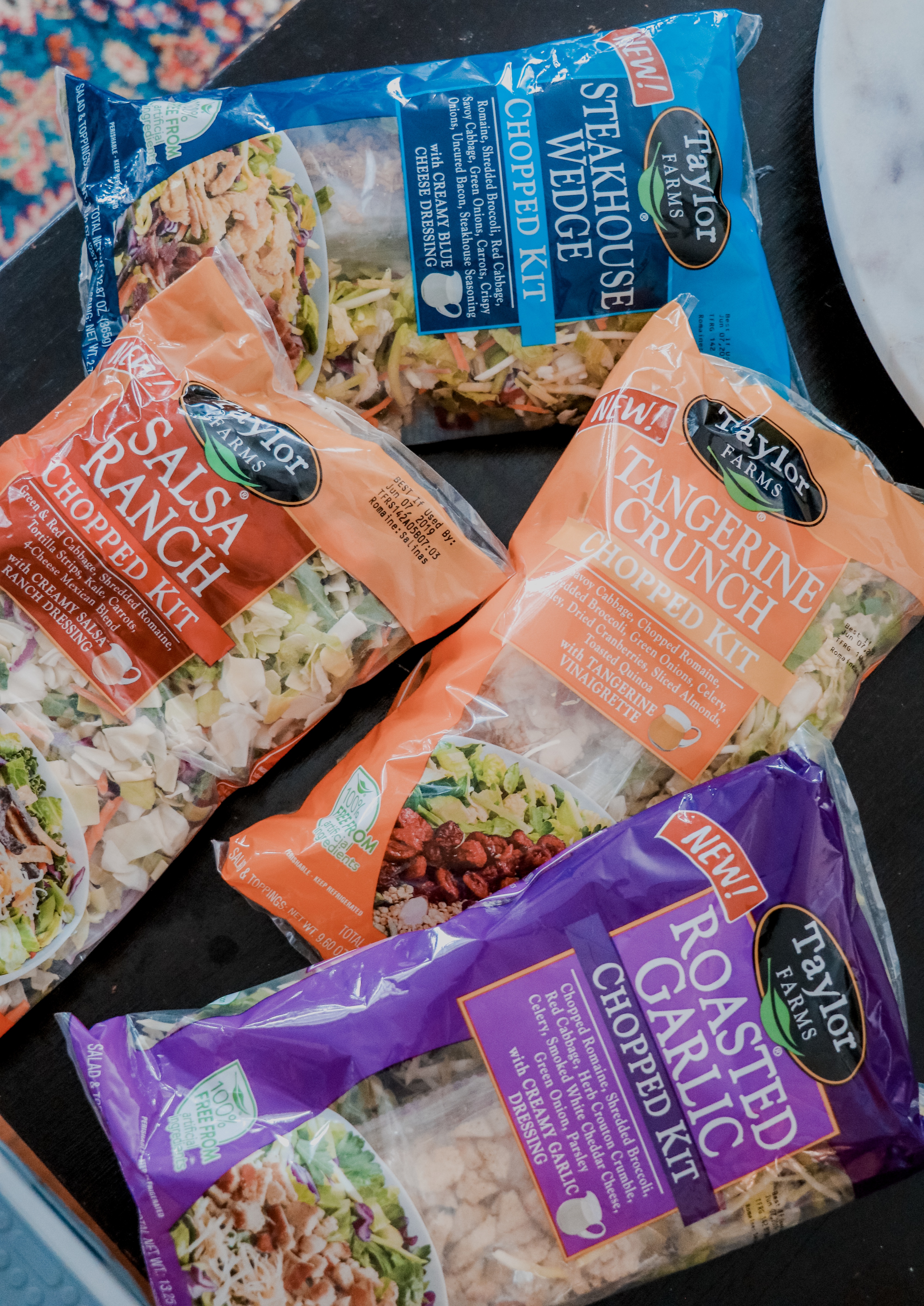 Taylor Farms Recipes featured by top US lifestyle blog Nashville Wifestyles | We LOVE Taylor Farms in this household. We make it a part of our meal everyday. Taylor Farms salad kits are comprised of multiple bags inside a bag. Each bag contains a different compartment of the salad: cheese, croutons and dressing. Take the ingredients, toss them in a bowl, stir & it’s ready to serve! It can be used as a main course or a side salad. Our favorites are the Buffalo Ranch Chopped and the Caesar Chopped. It’s simple and tasty! Click for full recipes!