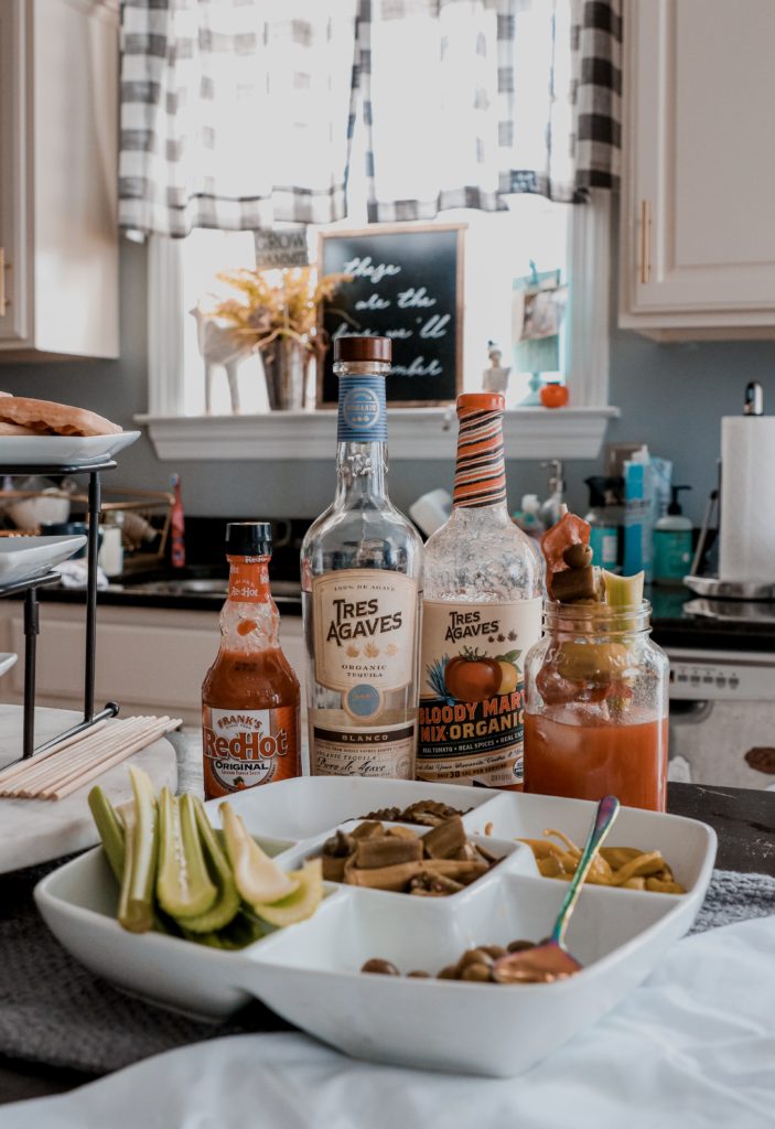 Bloody Maria: A Tequila Bloody Mary Recipe - Nashville Wifestyles; I love a good bloody mary. I love ordering them for brunch and they’re the best spicy cocktail. Luckily, I can make a bloody mary at home in less than 3 minutes. I recently discovered the most delicious bloody mary mixer that not only makes brunch time easier but is made with all natural ingredients. I substituted tequila for my bloody mary and it blew me away how delicious it was. So obviously I wanted to share with you guys this Tequila Bloody Mary Recipe. Click to read! | Southern Style Brunch Ideas That Pulls Out All the Stops by popular Nashville lifestyle blog, Nashville Wifestyles: image of a veggie platter and Tres Agaves drink mix.