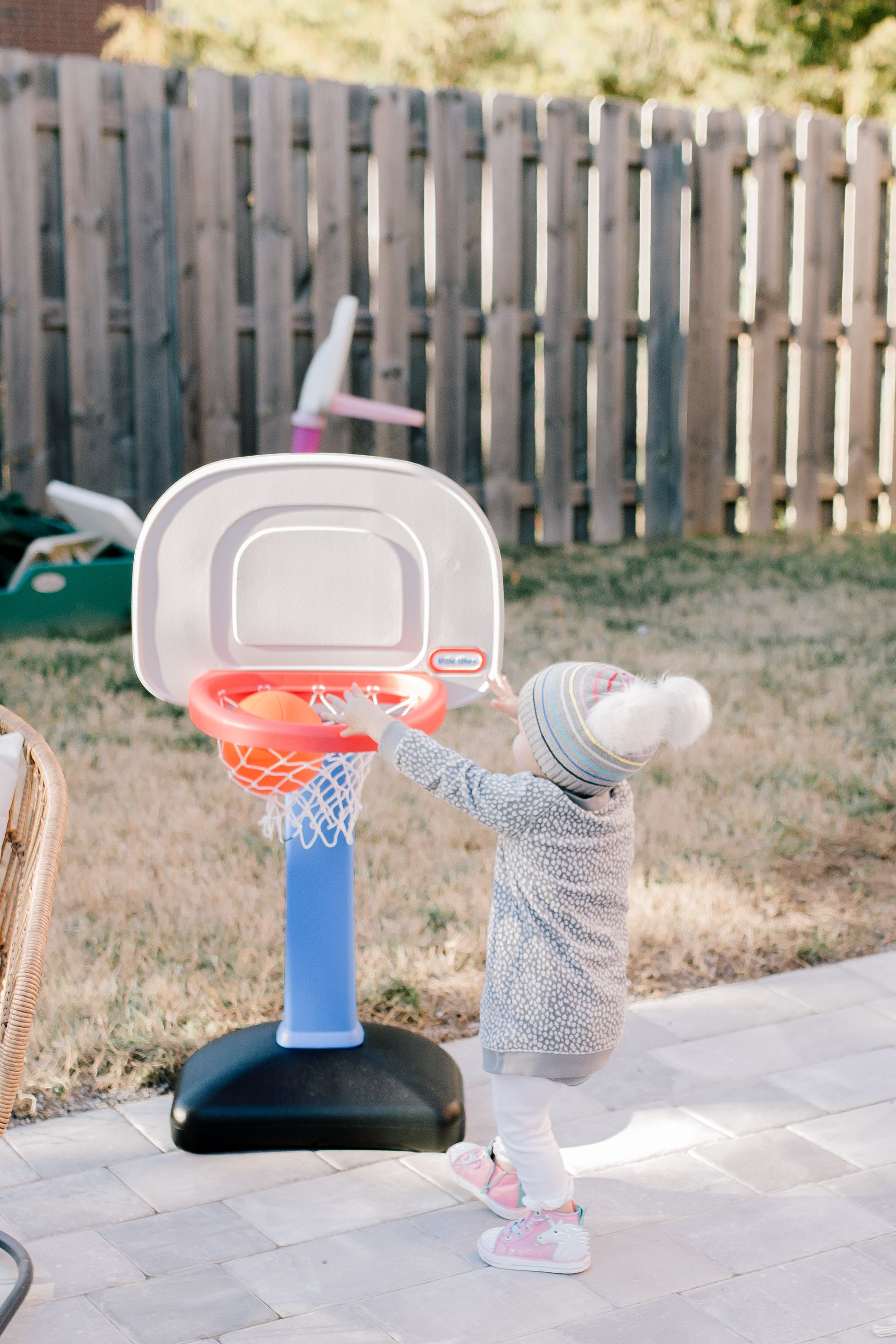 Best Christmas Gifts For Kids - Nashville Wifestyles; Christmas is approaching fast! I am on my A game this year. With my kids being 4.5 years apart it can be tricky when buying their presents because they are at such different age brackets. I’m sure you guys can relate to the struggle of figuring out what to buy your kids each Christmas, so I’m here to offer any guidance I can. Luckily in addition to the amazing prices Walmart and Target already have when you sign up for the Ibotta app you can also get rewarded when you spend. | Best Gifts For Kids by popular Nashville life and style blog, Nashville Wifestyles: image of a little girl playing with a basketball hoop.