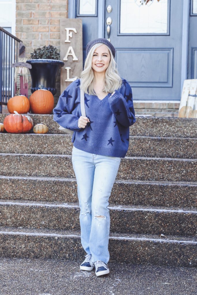 Vici Nashville Fall Fashion || Nashville's Newest Clothing Obsession by popular Nashville fashion blog, Nashville Wifestyles: image of a woman wearing a Vici Nashville star sweater, Vici Nashville HEADLINER FAUX SUEDE GLITTER SNEAKERS, Vici Nashville MCGUIRE HIGH RISE DISTRESSED DENIM, and Vici Nashville beanie.