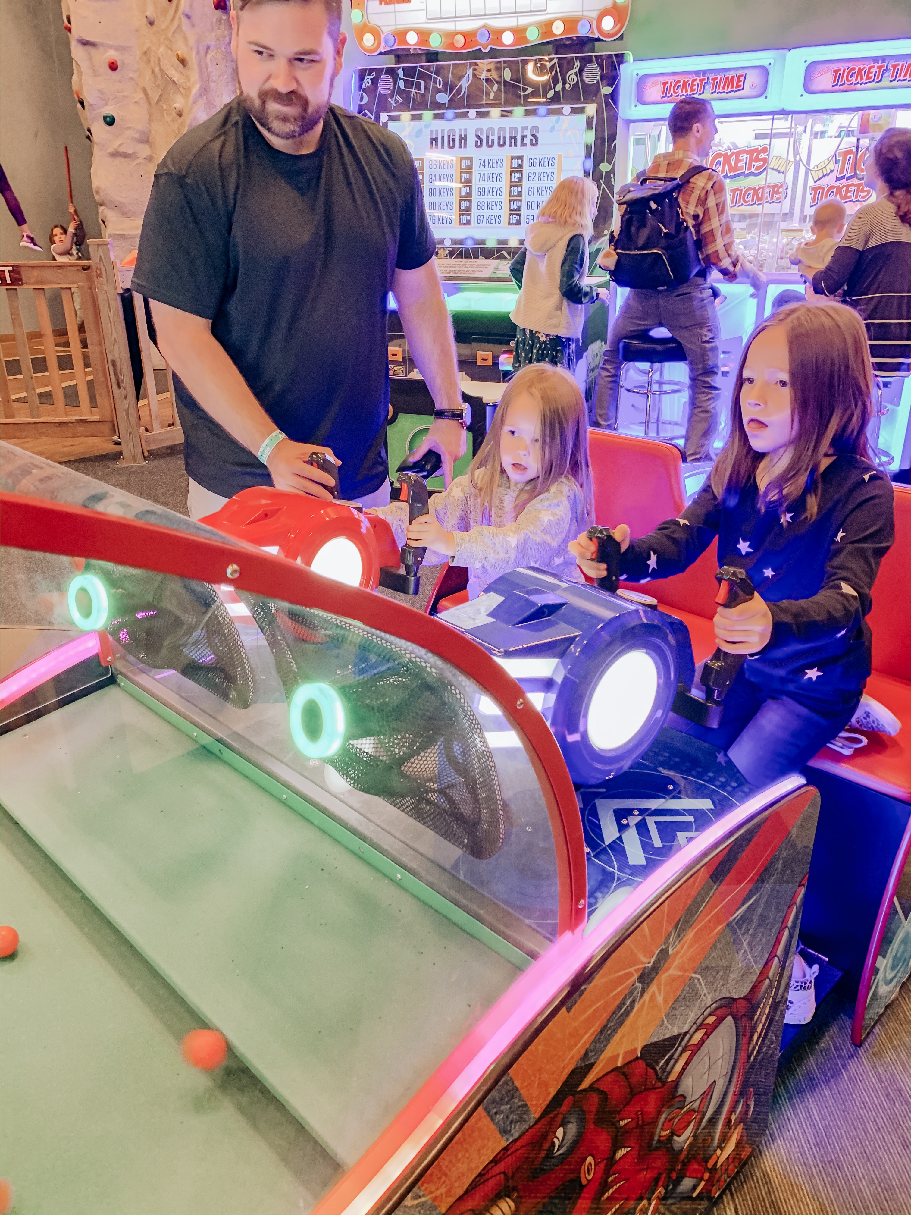 What To Do With A Weekend in Pigeon Forge || Wilderness At The Smokies - Nashville Wifestyles; The Smoky Mountains feel like home. I have spent many weekends in Pigeon Forge since I grew up close to the area in East TN. We went on school trips to Dollywood, my family rented cabins and I have many milestone moments there with Matt and the girls. How had I never been to Wilderness at the Smokies? I remember before I had children of my own hearing my friends talk about how amazing it was and how much fun their kids had. I had so much planned like driving to Gatlinburg. | What To Do With A Weekend in Pigeon Forge || Wilderness At The Smokies by popular travel blog, Nashville Wifestyles: image of a family at the Wilderness at the Smokies resort.