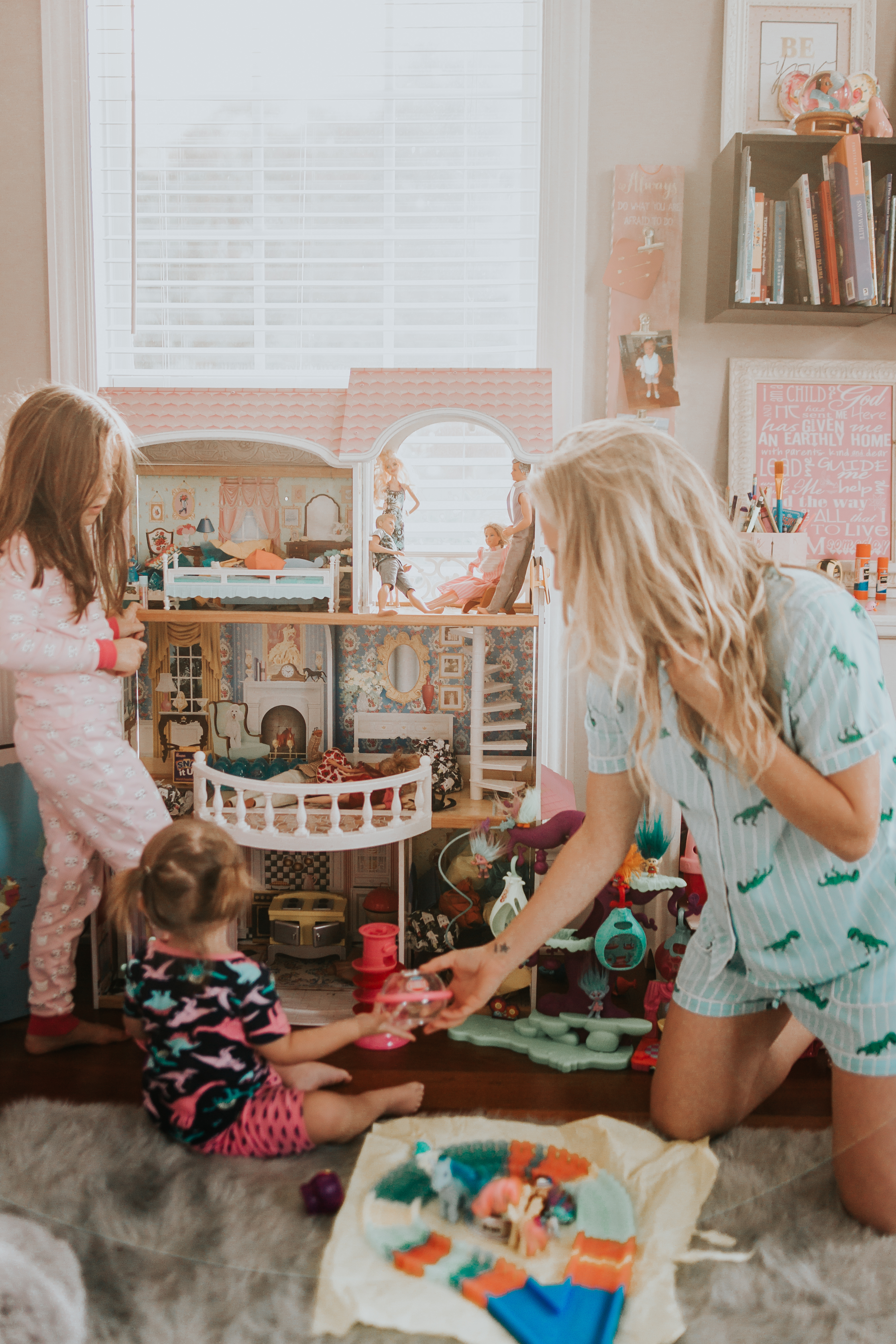 Best Christmas Gifts For Kids - Nashville Wifestyles; Christmas is approaching fast! I am on my A game this year. With my kids being 4.5 years apart it can be tricky when buying their presents because they are at such different age brackets. I’m sure you guys can relate to the struggle of figuring out what to buy your kids each Christmas, so I’m here to offer any guidance I can. Luckily in addition to the amazing prices Walmart and Target already have when you sign up for the Ibotta app you can also get rewarded when you spend. | Best Gifts For Kids by popular Nashville life and style blog, Nashville Wifestyles: image of two girls playing in a room full of toys.