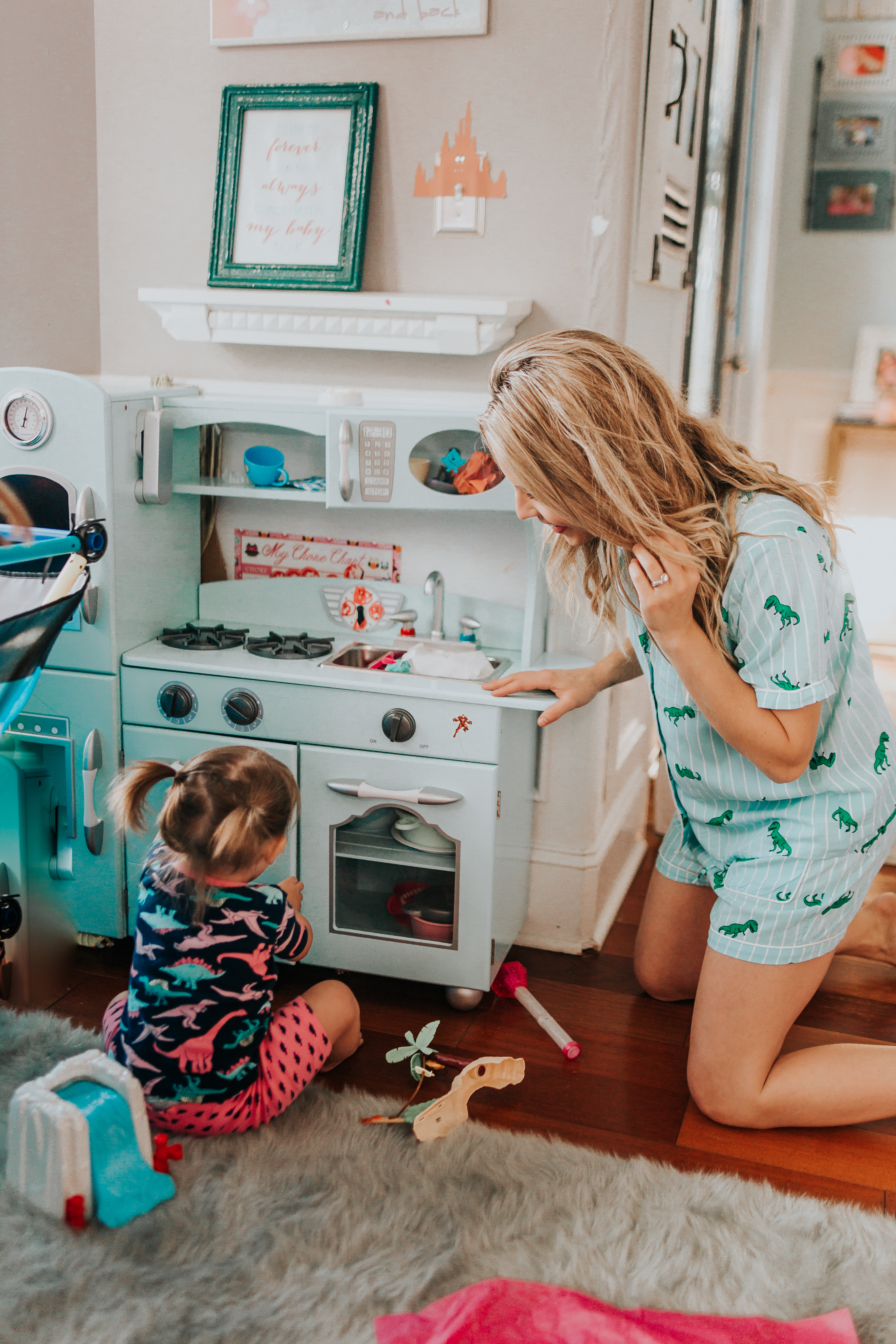 Best Christmas Gifts For Kids - Nashville Wifestyles; Christmas is approaching fast! I am on my A game this year. With my kids being 4.5 years apart it can be tricky when buying their presents because they are at such different age brackets. I’m sure you guys can relate to the struggle of figuring out what to buy your kids each Christmas, so I’m here to offer any guidance I can. Luckily in addition to the amazing prices Walmart and Target already have when you sign up for the Ibotta app you can also get rewarded when you spend. | Best Gifts For Kids by popular Nashville life and style blog, Nashville Wifestyles: image of two girls playing in a room full of toys.