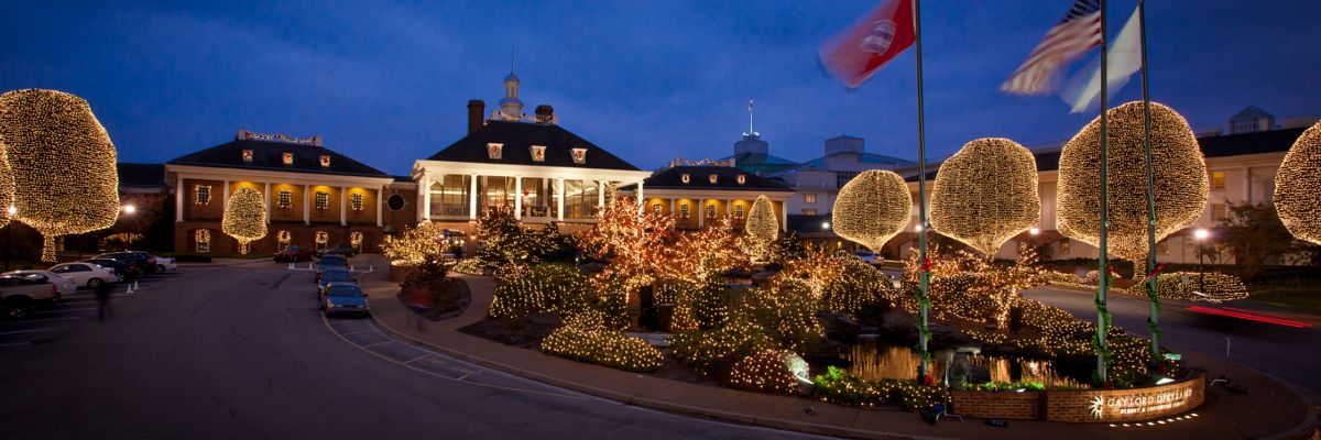 HOLIDAY TRAVEL: What Makes Christmas at the Gaylord Opryland in Nashville So Special - Nashville Wifestyles; It’s Christmas season at Gaylord Opry which is one of my very favorite holiday traditions. If you’re making plans to travel to Nashville around Christmas or a local looking for things to do, one of the most sought after is visiting the infamous Gaylord Opryland Resort and Hotel. It is one most beautiful and magical moments you can experience. WE go EVERY single year from the time Keatyn was a baby. I scoured their website for detailed info paired with my local knowledge. Click to read more! | HOLIDAY TRAVEL: What Makes Christmas at the Gaylord Opryland in Nashville So Special by popular Nashville blog, Nashville Wifestyles: image of Christmas lights at Gaylord Opryland.