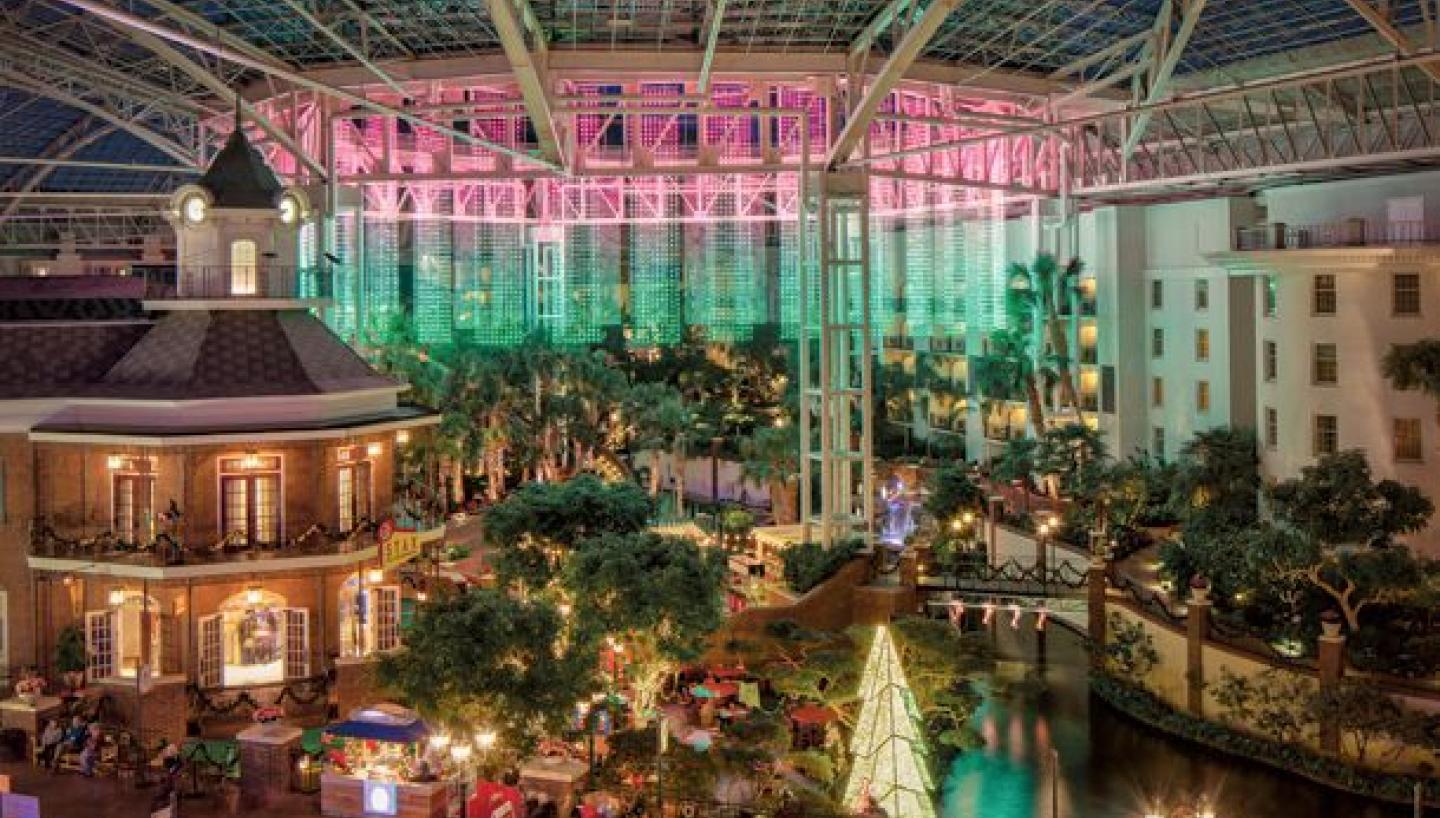 HOLIDAY TRAVEL: What Makes Christmas at the Gaylord Opryland in Nashville So Special - Nashville Wifestyles; It’s Christmas season at Gaylord Opry which is one of my very favorite holiday traditions. If you’re making plans to travel to Nashville around Christmas or a local looking for things to do, one of the most sought after is visiting the infamous Gaylord Opryland Resort and Hotel. It is one most beautiful and magical moments you can experience. WE go EVERY single year from the time Keatyn was a baby. I scoured their website for detailed info paired with my local knowledge. Click to read more! | HOLIDAY TRAVEL: What Makes Christmas at the Gaylord Opryland in Nashville So Special by popular Nashville blog, Nashville Wifestyles: image of Christmas lights at Gaylord Opryland.
