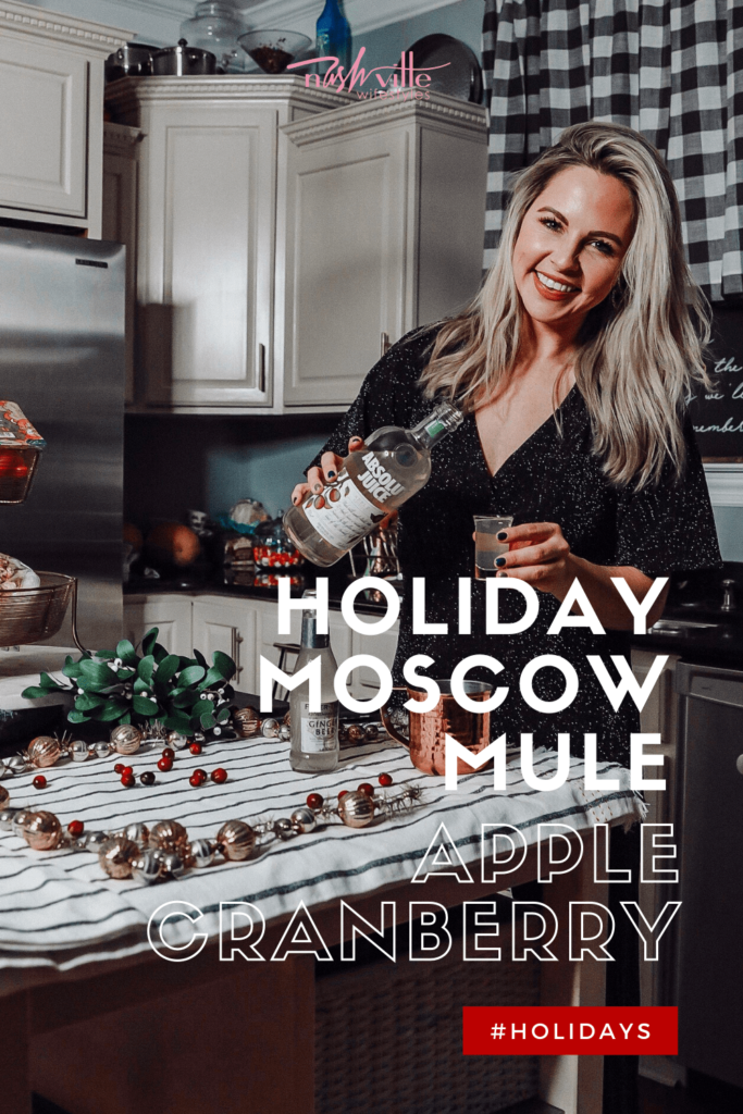 Holiday Moscow Mule || Apple Cranberry by popular Nashville life and style blog, Nashville Wifestyles: image of a woman making a Moscow Mule.