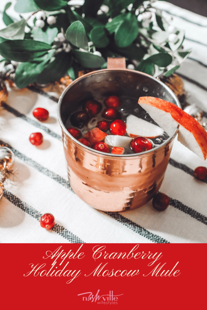 Holiday Moscow Mule || Apple Cranberry by popular Nashville life and style blog, Nashville Wifestyles: image of a holiday Moscow Mule in a copper mug.