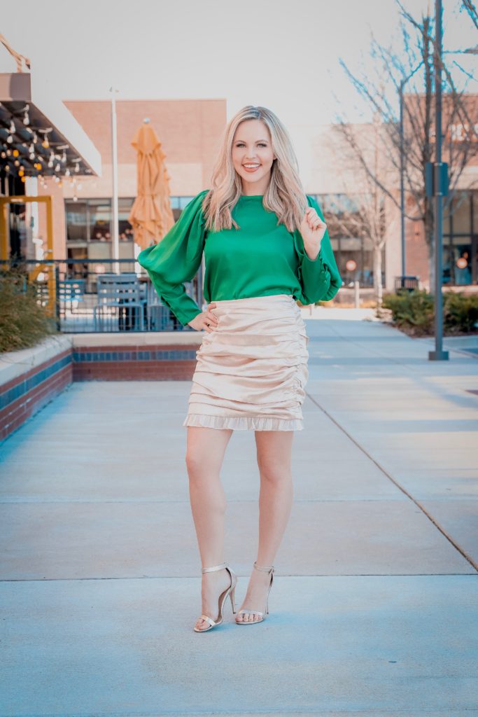 Holiday Looks With VICI - Nashville Wifestyles; Who else is covered up in holiday parties? I mean even if I'm not I just throw on a sequin dress for the heck of it because the holidays are my ABSOLUTE favorite. Between the work parties, family parties and your friend's Christmas gatherings VICI has you covered on your snazzy outfit needs. They keep dropping new collections and with each one I become more and more obsessed. ALSO these looks are perfect for New Years. Use my code ASHLEYH20 to get 20% off! Click for the looks! | Holiday Looks With VICI Fashion by popular Nashville fashion blog, Nashville Wifestyles: image of a woman wearing a Vici GILLIAN SATIN RUCHED MINI SKIRT and ASHTON SATIN BLOUSE.