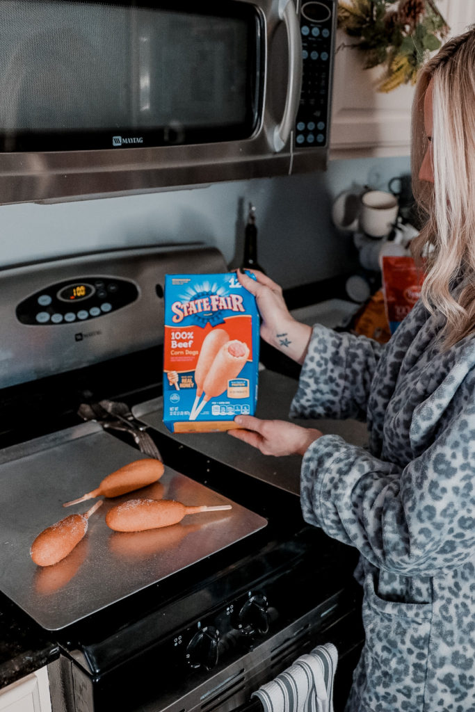 Easy Game Day Entertaining In Less Than 30 Minutes by popular Nashville lifestyle blog, Nashville Wifestyles: image of a woman cooking various Tyson frozen food products. 