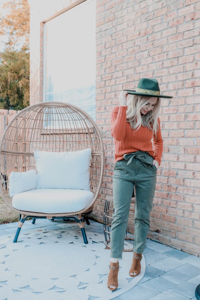 Stylish Weekend Outfit Ideas by popular Nashville mom fashion blog, Nashville Wifestyles: image of a woman wearing a orange ribbed turtleneck sweater, green paper bag pants, peep toe shoes, and a Amazon Lack of Color Women's Melodic Wide-Brimmed Wool Fedora.