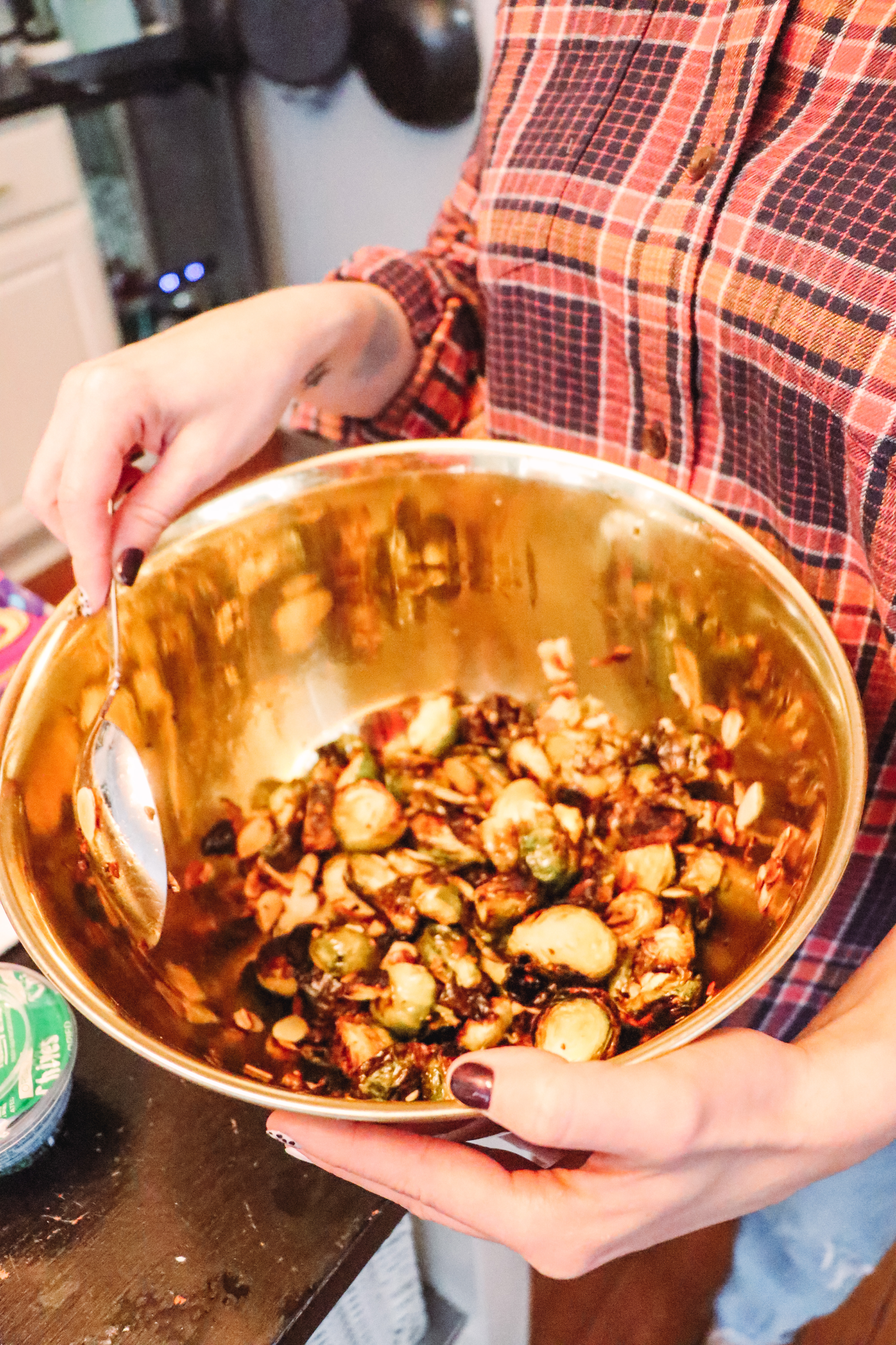 Honey Roasted Brussel Sprouts by popular Nashville life and style blog, Nashville Wifestyles: image of honey roasted Brussel sprouts in a metal bowl.